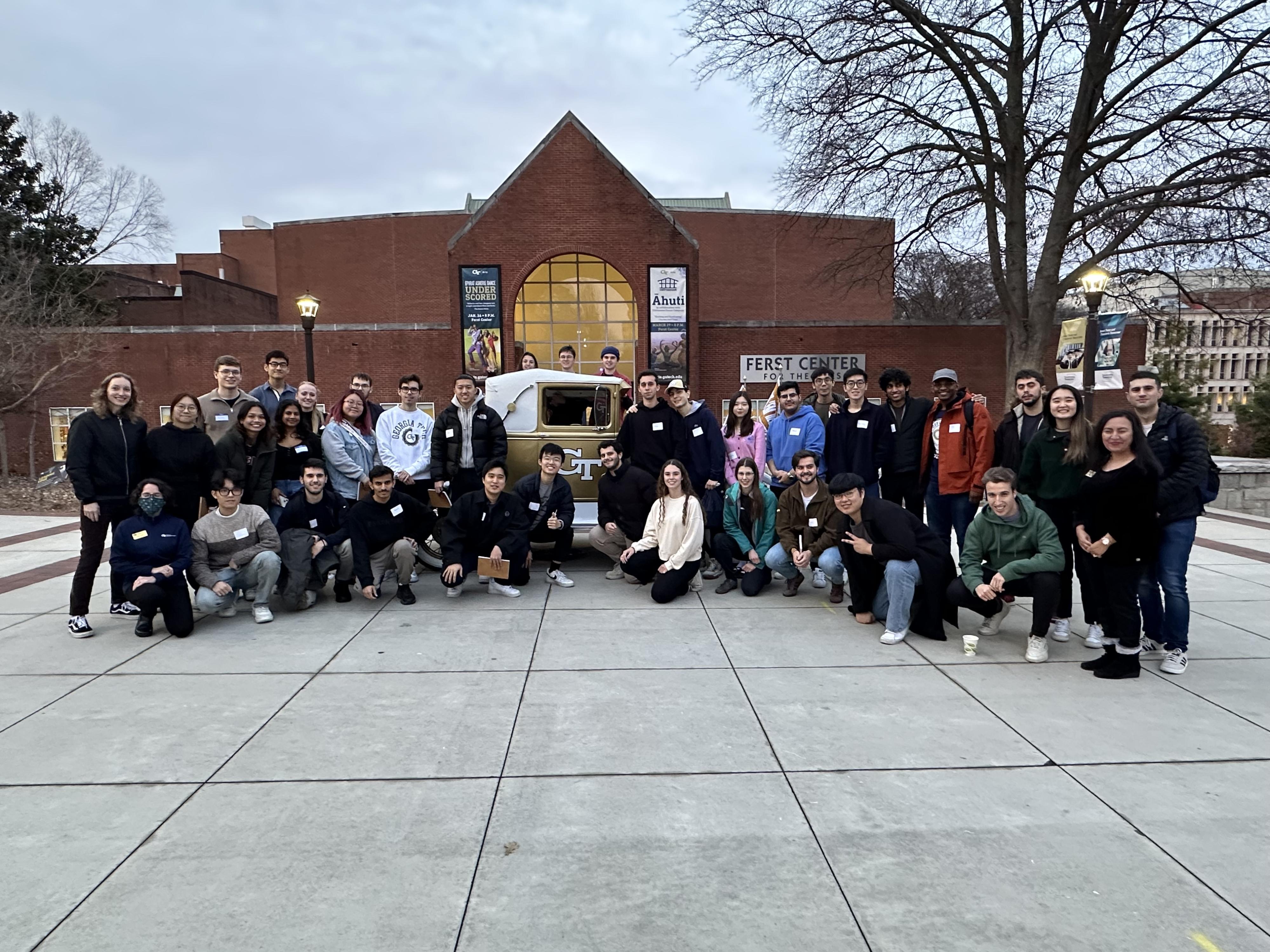 Students posing for a photo with Ramblin' Reck.