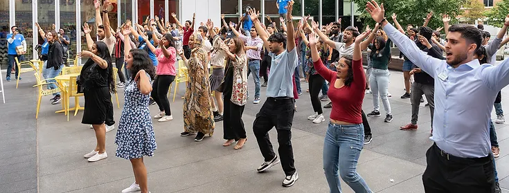 Students line dancing at the welcome reception.